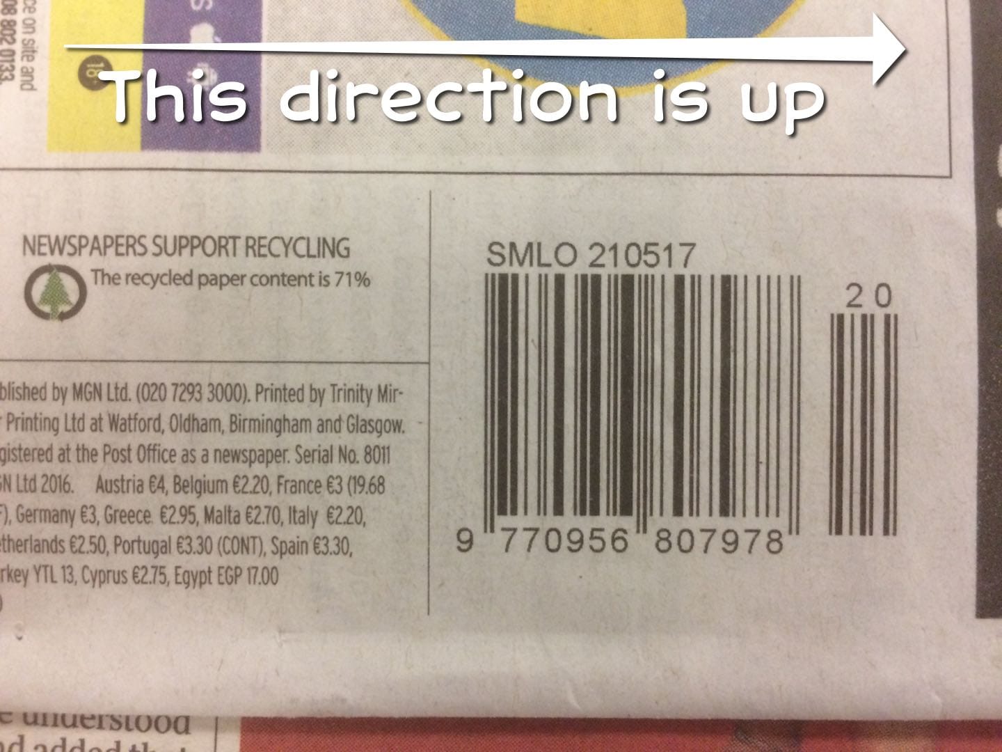 A photograph of a barcode on the back of the Sunday Mirror, rotated so that it is placed sideways on the page.