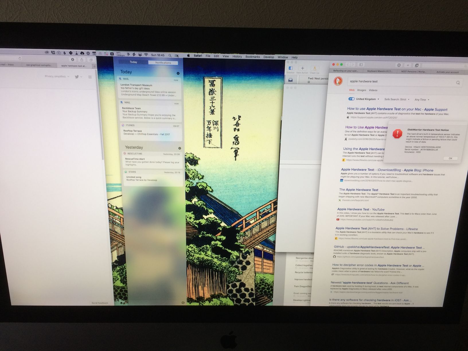 Photo of an iMac where part of the right-hand section of the screen image is displayed physically on the left